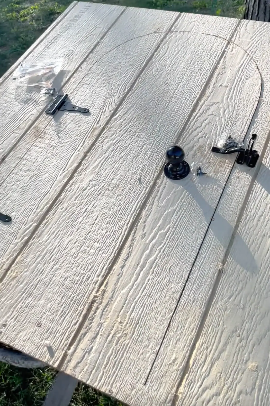 Adding hardware to our low cost DIY chicken coop.